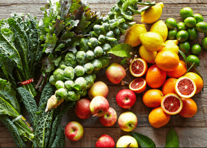 a group of fruits and vegetables on a wood surface Healthy Weight Loss Diets Bedford